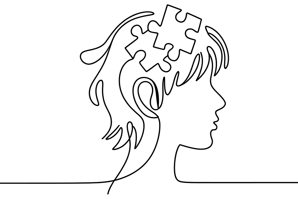 頭部にパズルのピースが描かれた人物の横顔の線画。
